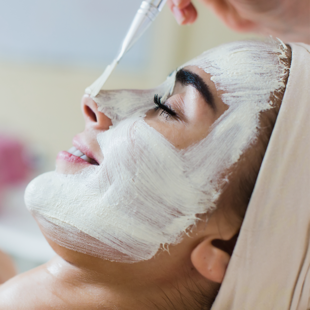Woman receiving a Lira Clinical chemical peel treatment at Dandelion Medical Aesthetics in Littleton, CO